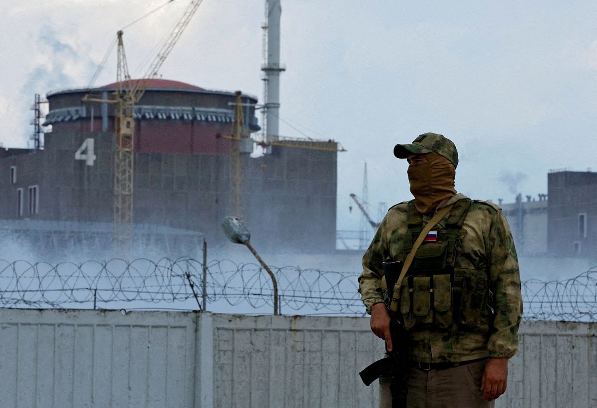 File Photo: A serviceman with a Russian flag on his uniform stands guard near the Zaporizhzhia Nuclear Power Plant in the Zaporizhzhia region, Ukraine, August 4, 2022. (REUTERS/Alexander Ermochenko)