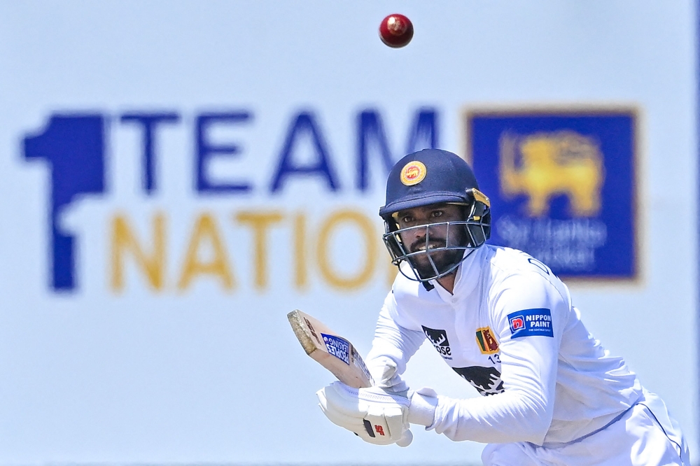 Sri Lanka's Dhananjaya de Silva runs between the wickets during the second day of the first cricket Test match between Sri Lanka and Pakistan at the Galle International Cricket Stadium in Galle on July 17, 2023. (Photo by Ishara S. Kodikara / AFP)
