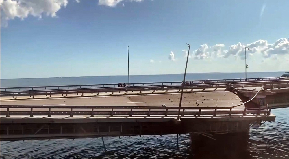 This video grab taken from a Crimea24TV footage on July 17, 2023 shows the damaged Kerch bridge -- linking Crimea to Russia. (Photo by Crimea24TV / AFP)
 
