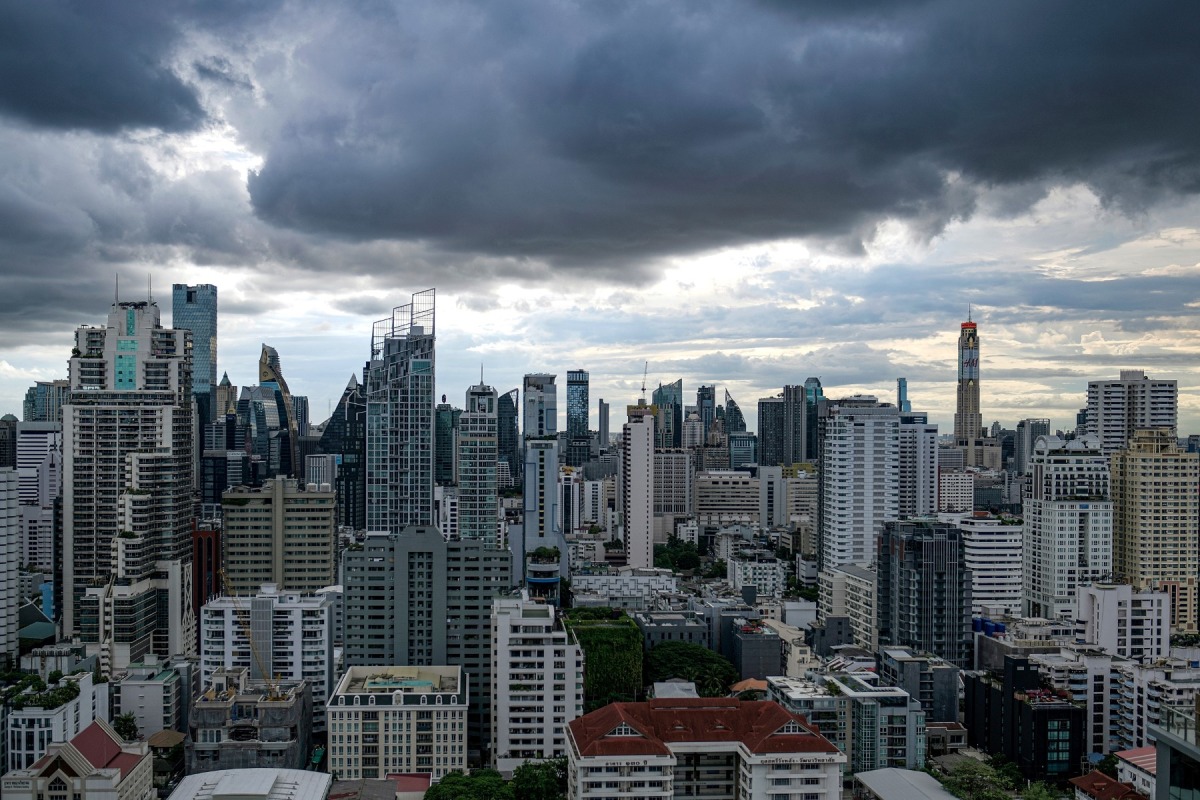 This photo taken on July 2, 2023 shows high rise commercial and residential buildings in downtown Bangkok. (Photo by Amaury PAUL / AFP)