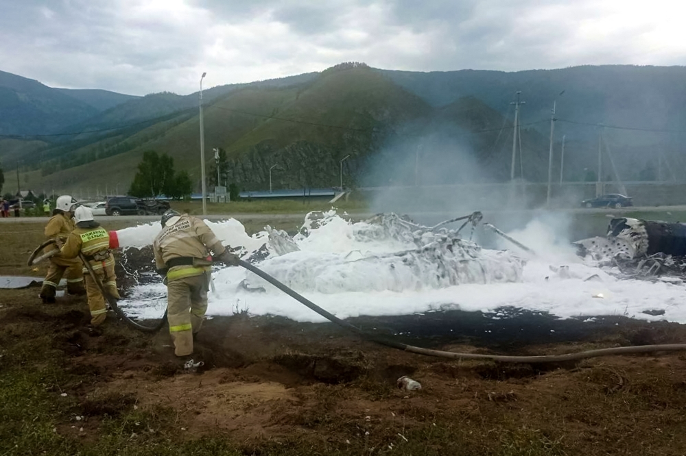 This handout picture released by the Russian emergency situations ministry shows the ministry's personnel working at the site of a helicopter crash in the southern Siberian region of Altai on July 27, 2023. Photo by Handout / Russian Emergencies Ministry / AFP