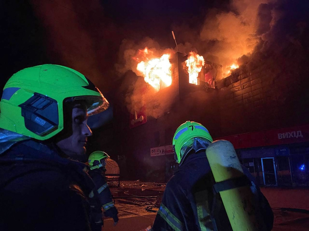 This handout photograph taken and released by Ukrainian Emergency Service on August 14, 2023, shows rescuers pushing out a fire in a supermarket after a night strike in Odesa on August 14, 2023, amid Russian invasion in Ukraine. (Photo by Handout / UKRAINIAN EMERGENCY SERVICE / AFP)