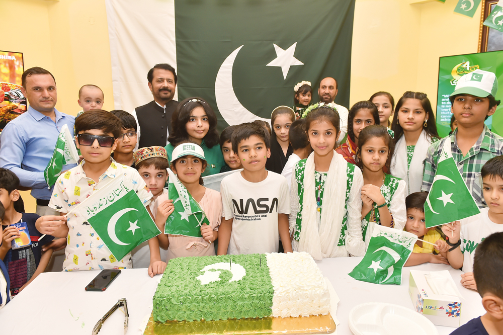 Children with the Ambassador during the cake-cutting ceremony at the embassy. Pics: Abdul Basit