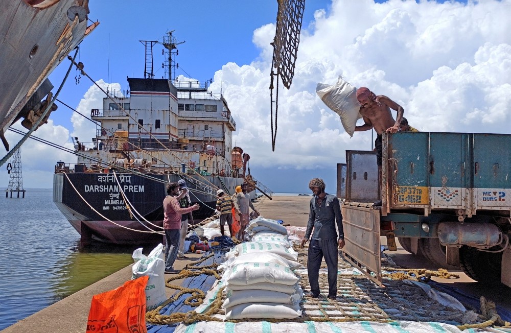 File Photo: Labourers unload rice bags from a supply truck at India's main rice port at Kakinada Anchorage in the southern state of Andhra Pradesh, India, on September 2, 2021. (Rajendra Jadhav/Reuters)