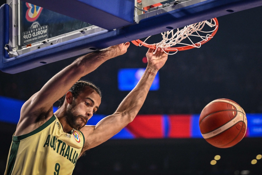 Australia's Xavier Cooks dunks the ball during the FIBA Basketball World Cup group F match between Australia and Japan at Okinawa Arena in Okinawa on August 29, 2023. (Photo by Yuichi Yamazaki / AFP)