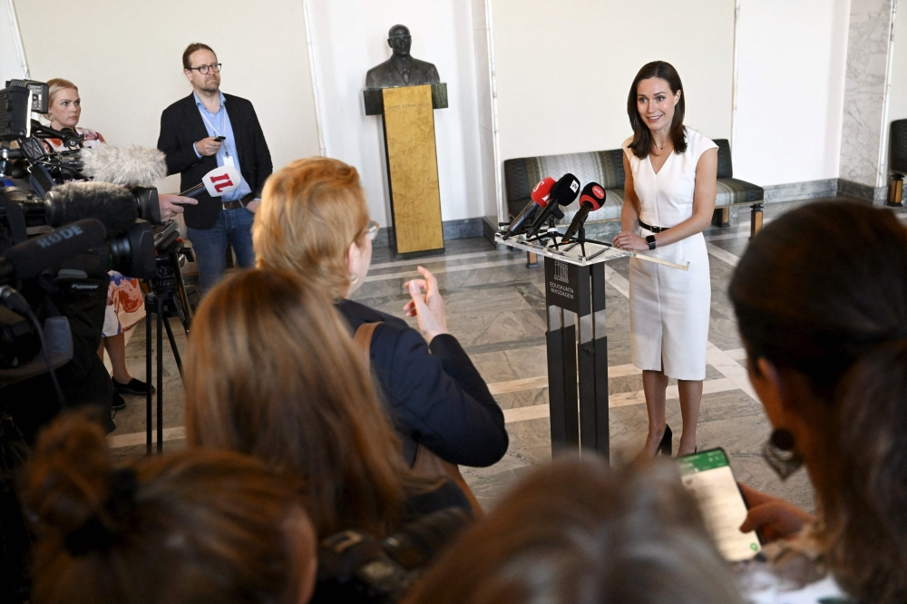 Former Prime Minister of Finland and member of the Finnish parliament Sanna Marin speaks to journalists at the Finnish parliament in Helsinki, Finland on September 7, 2023. (Photo by Vesa Moilanen / Lehtikuva / AFP)