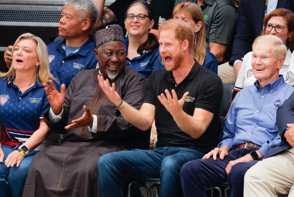Britain's Prince Harry, Duke of Sussex reacts as he attends the Wheelchair Rugby Canada vs New Zealand match of the 2023 Invictus Games in Duesseldorf, western Germany on September 10, 2023. (Photo by Odd Andersen / AFP)