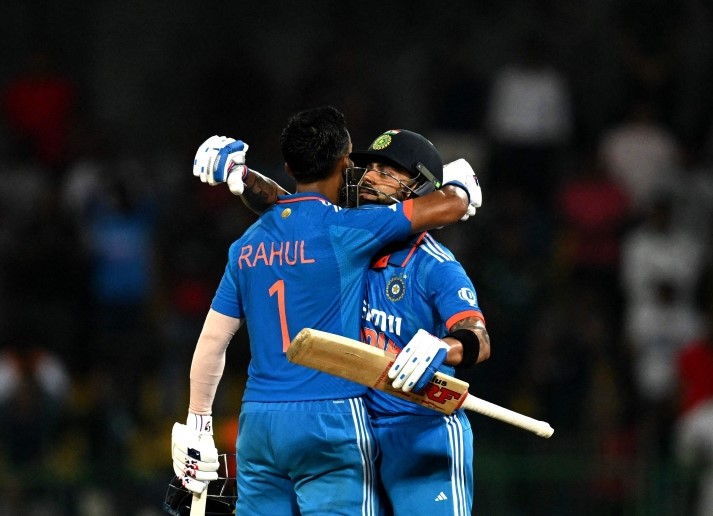 India's KL Rahul (left) celebrates with teammate Virat Kohli after scoring a century (100 runs) during the Asia Cup 2023 super four one-day international (ODI) cricket match between India and Pakistan at the R. Premadasa Stadium in Colombo on September 11, 2023. (Photo by Farooq Naeem / AFP)