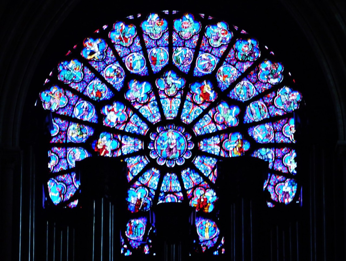 Picture of stained glass at Notre Dame used for representation. Wikimedia Commons / Zairon 