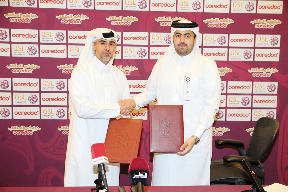 Executive Director of Sales, Marketing & Communication at QSL Hassan Rabiah Al Kuwari and Director PR, Sponsorship and CSR at Ooredoo Sabah Rabiah Al Kuwari after a press conference yesterday.  