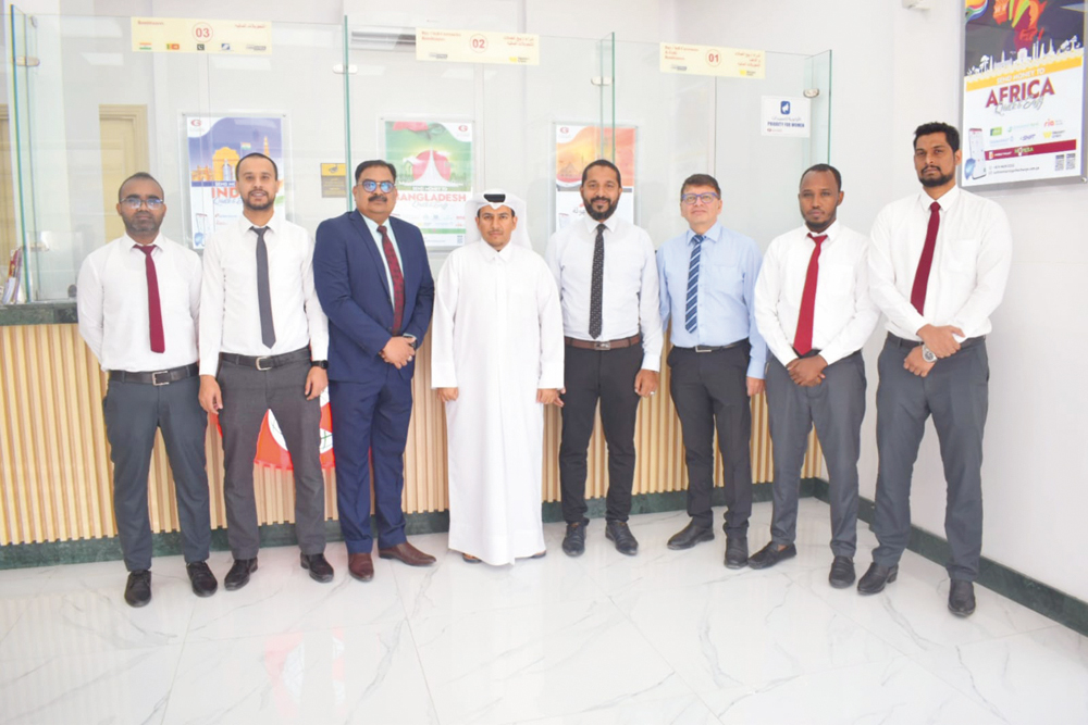 Gulf Exchange officials during the inauguration of its 14th branch in Umm Slal Mohammed.