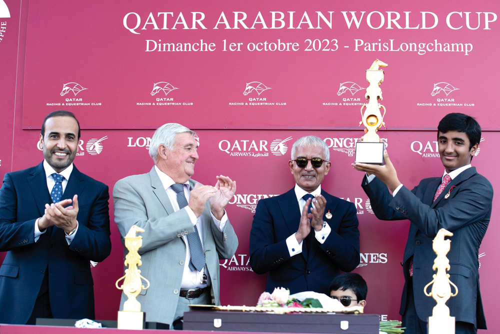 H E Sheikh Abdullah bin Khalifa Al Thani presented the Gr.1 (PA) Qatar Arabian World Cup winner's trophy to H E Sheikh Hamad bin Joaan Al Thani after Al Shaqab Racing's purebred Arabian colt Al Ghadeer won the race. QREC Chairman Issa bin Mohammed Al Mohannadi also present.
