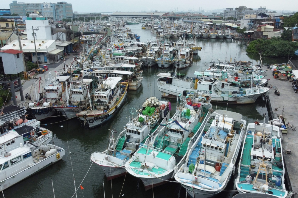 Fishing boats are moored at Tunggang fishing harbour ahead of the arrival of Typhoon Koinu in Pingtung county on October 4, 2023. Photo by Johnson LIU / AFP
