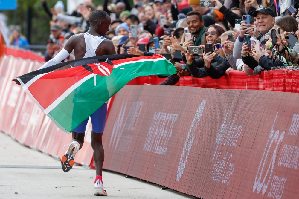 Kenya's Kelvin Kiptum celebrates winning the 2023 Bank of America Chicago Marathon in Chicago, Illinois, in a world record time of two hours and 35 seconds on October 8, 2023. (Photo by KAMIL KRZACZYNSKI / AFP)

