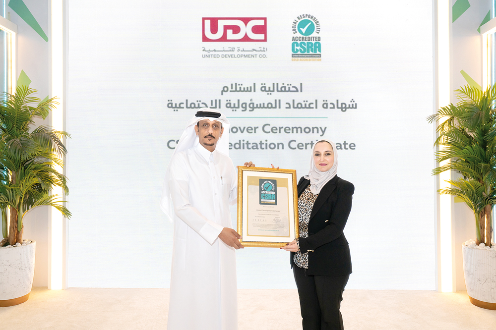 Director of Public Services at UDC, Abdullatif Al Yafei receiving CSR Accreditation from Dr. Hanaa Albanna, CSR Accreditation – MENA Region Representative.