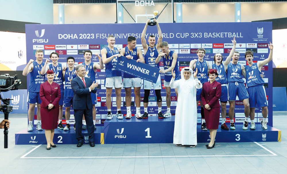 Qatar Collegiate Sports Federation President Dr. Ibrahim bin Saleh Al Naimi with the podium winners of the men's competition. 