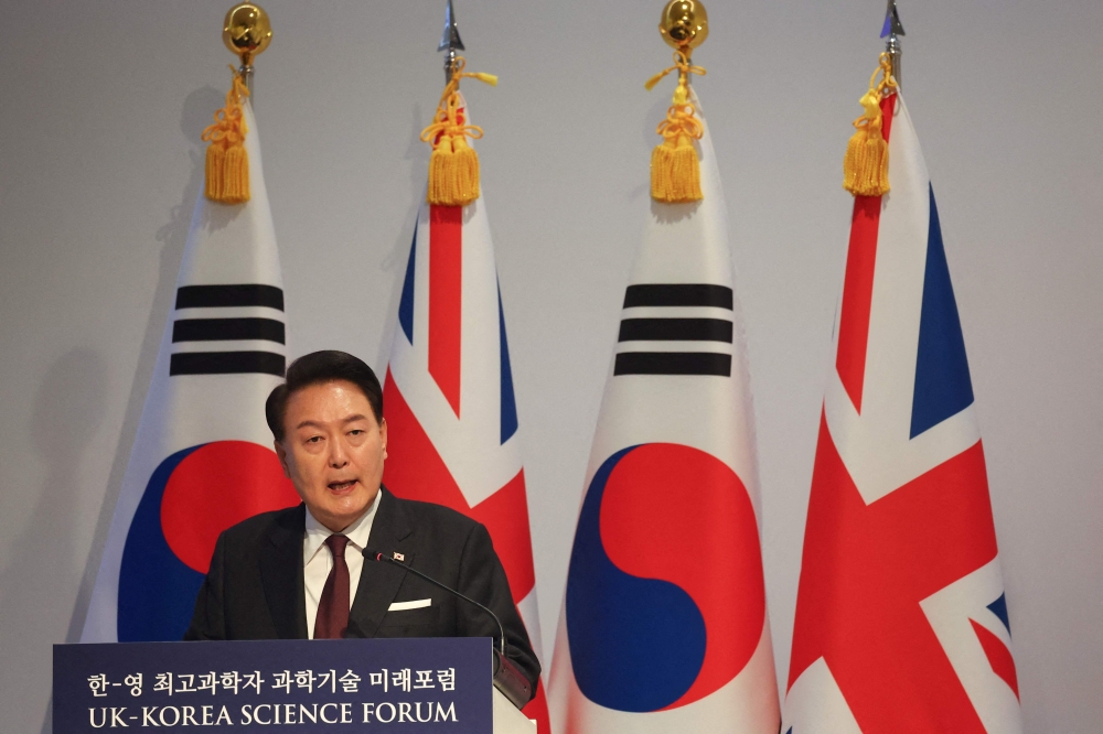 South Korea's President Yoon Suk Yeol delivers a speech at the Royal Society in London on November 22, 2023, on the second day of a three-day state visit to the UK. Photo by TOBY MELVILLE / POOL / AFP