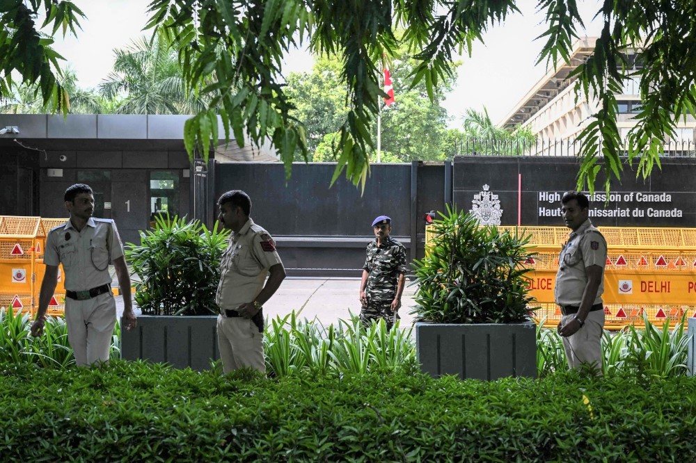 File: Security personnel stand guard in front of the High Commission of Canada in New Delhi on September 19, 2023. (Photo by Arun Sankar / AFP)