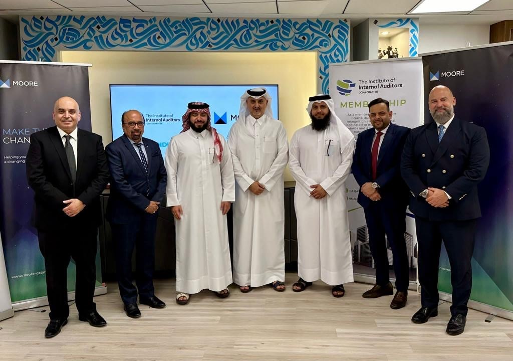 President of the IIA  Adel Al Hashimi, Managing Partner of Moore Qatar Sami Zaitoon with other officials during the MoU signing.