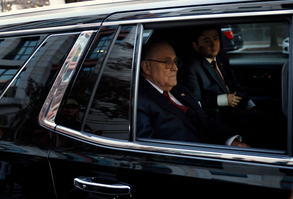 Rudy Giuliani, the former personal lawyer for former U.S. President Donald Trump, departs from the E. Barrett Prettyman U.S. District Courthouse after a verdict was reached in his defamation jury trial on December 15, 2023 in Washington, DC. (Photo by Anna Moneymaker / GETTY IMAGES NORTH AMERICA / Getty Images via AFP)
