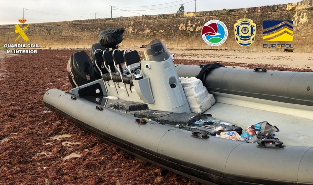 This handout photo taken in an undisclosed place and released on December 22, 2023 by Spain's Guardia Civil shows a speed boat loaded with parcels, seized as part of a drug trafficking investigation led simultaneously in Spain and Portugal and coordinated by Europol. (Photo by Spanish Guardia Civil / AFP)