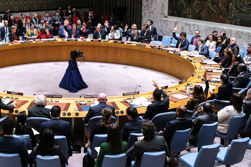 Ambassadors vote during a meeting about the situation in the Middle East, including the Palestinian question, at UN headquarters in New York on December 22, 2023. (Photo by Charly Triballeau / AFP)