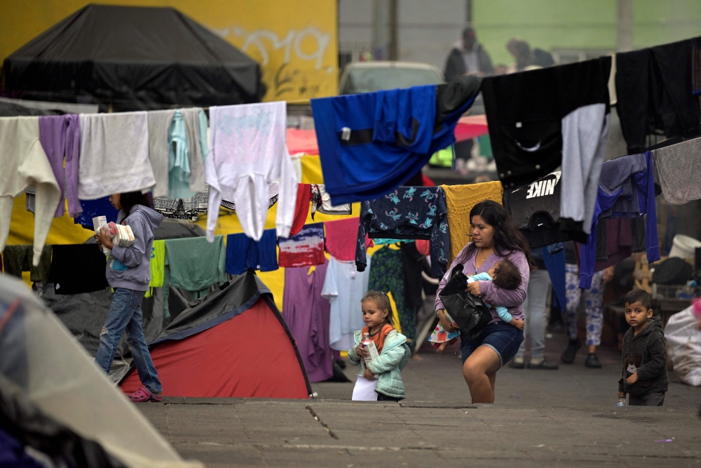 View of a makeshift camp in the Tlahuac area of Mexico City was taken on December 26, 2023. (Photo by ALFREDO ESTRELLA / AFP)
