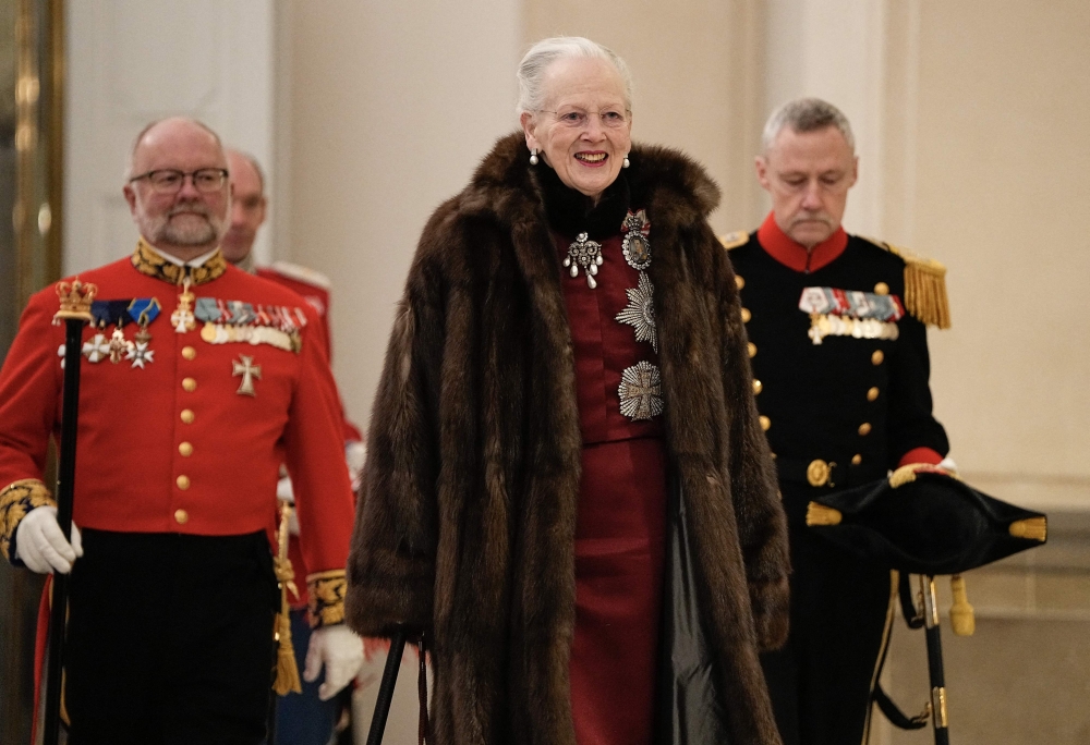 Queen Margrethe II of Denmark reviews an honour guard at Christiansborg Castle in Copenhagen on January 4, 2024. (Photo by Mads Claus Rasmussen / Ritzau Scanpix / AFP) 