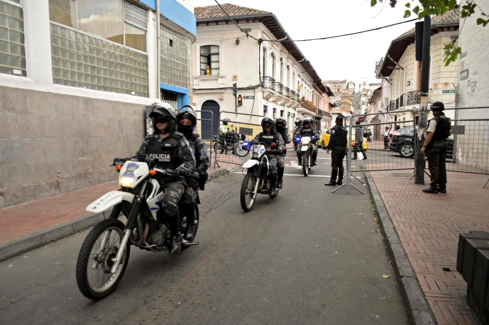 Ecuadorean security forces patrol the area around the main square and presidential palace after Ecuadorean President Daniel Noboa declared the country in a state of 