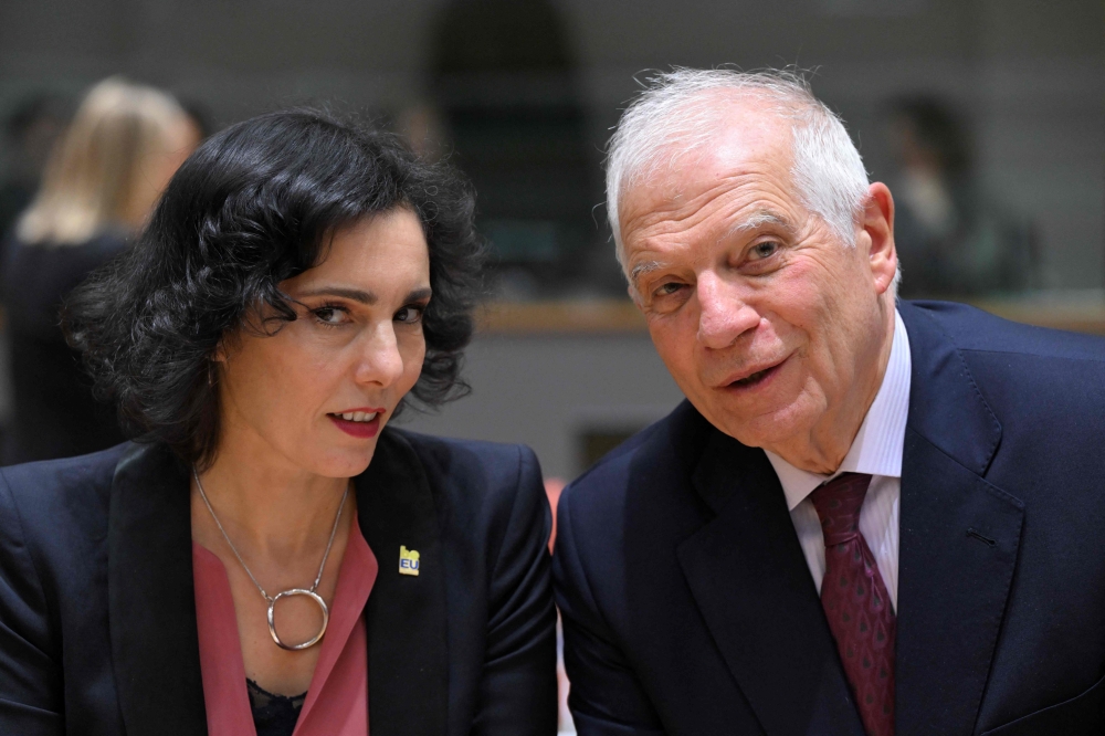 European Union for Foreign Affairs and Security Policy Josep Borrell (R) talks with Belgium's Minister of Foreign Affairs Hadja Lahbib (L) at the EU headquarters in Brussels on January 22, 2024. (Photo by John Thys / AFP)