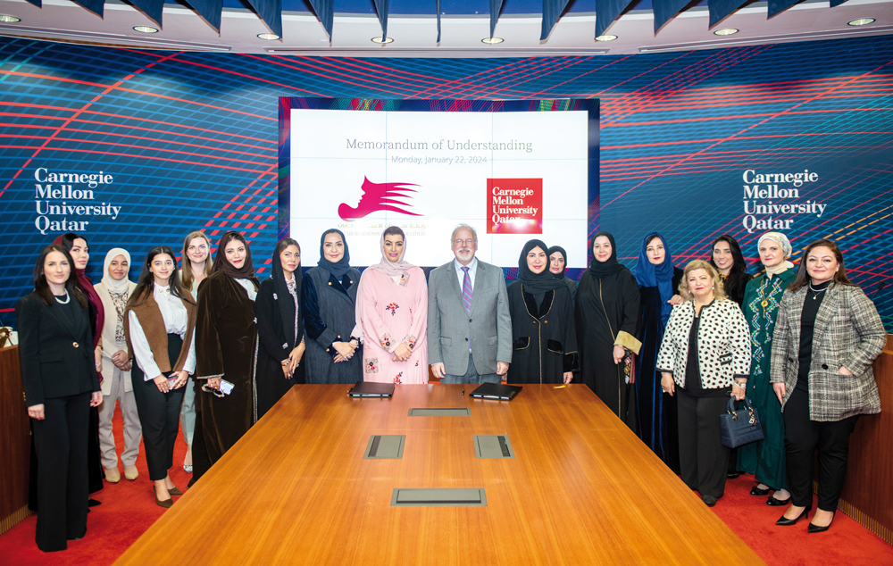 Officials from CMU-Q and QBWA during the MoU signing event.
