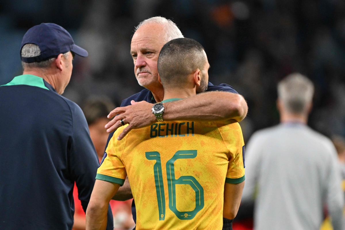 Australia’s coach Graham Arnold consoles Australia’s defender Aziz Behich after the Asian Cup quarter-final.