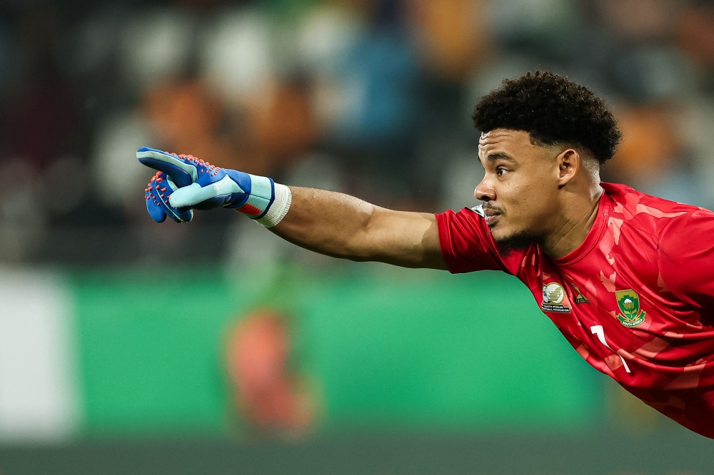 South Africa's goalkeeper #1 Ronwen Williams celebrates after winning at the end of the Africa Cup of Nations (CAN) 2024 quarter-final football match between Cape Verde and South Africa at the Stade Charles Konan Banny in Yamoussoukro on February 3, 2024. (Photo by FRANCK FIFE / AFP)
