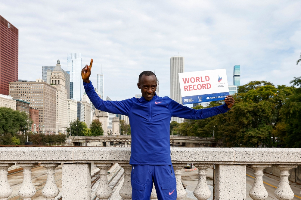 (Files) Kenya's Kelvin Kiptum celebrates winning the 2023 Bank of America Chicago Marathon in Chicago, Illinois, on October 8, 2023. (Photo by Kamil Krzaczynski / AFP)