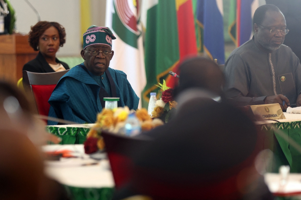 Nigeria's President and Chairman, Economic Community of West African States Commission (ECOWAS) Bola Tinubu, looks on during the extraordinary session of Economic Community of West African States (ECOWAS) Heads of State and Government in Abuja, Nigeria on February 24, 2024. (Photo by Kola Sulaimon / AFP)
