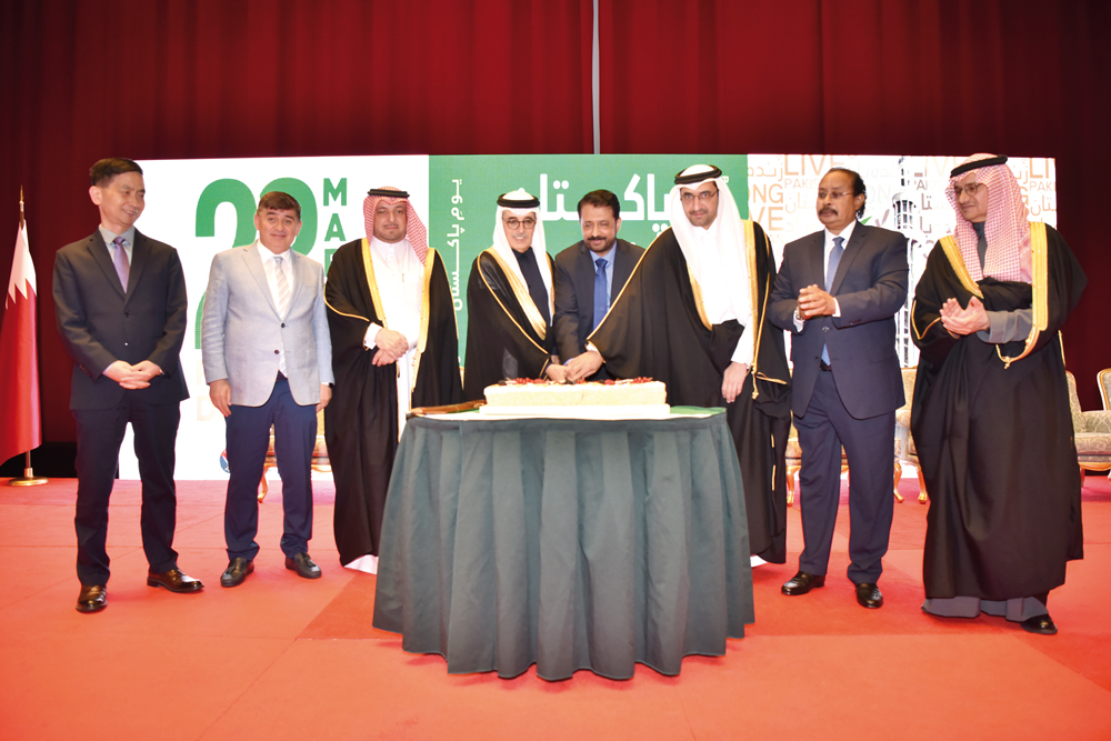 Minister of Justice and Minister of State for Cabinet Affairs H E Ibrahim bin Ali bin Issa Al Hassan Al Muhannadi (third right), Minister of State and President of Qatar National Library H E Dr. Hamad bin Abdelaziz Al Kawari (fourth left), Ambassador of Pakistan to Qatar H E Muhemmed Aejaz (fourth right) with Their Excellencies Ambassadors and Dignitaries at a ceremony to mark the National Day of Pakistan.