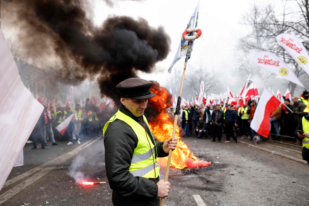 Polish farmers demonstrate against EU climate measures and Ukrainian imports on March 6, 2024 in Warsaw, Poland. (Photo by Wojtek Radwanski / AFP)
