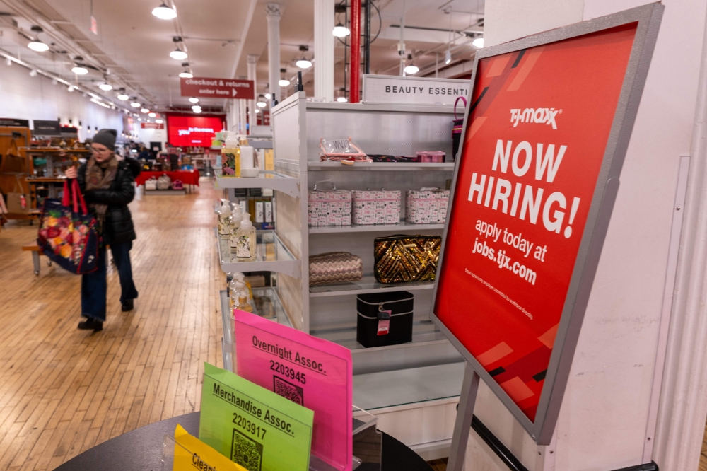 (FILES) A 'now hiring' sign is displayed in a retail store in Manhattan on January 05, 2024 in New York City. Hiring in the US stayed robust in February while unemployment crept up, US Department of Labor data showed on March 8, 2024. (Photo by SPENCER PLATT / GETTY IMAGES NORTH AMERICA / AFP)
