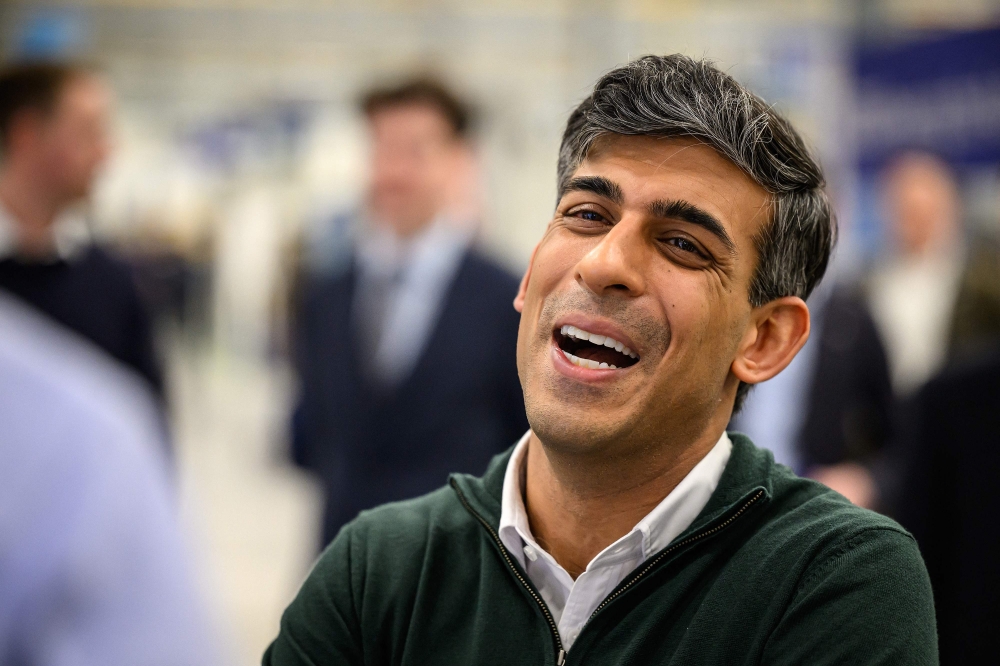Britain's Prime Minister Rishi Sunak speaks with technical apprentices during a visit to the Rolls-Royce manufacturing facility in Bristol on March 14, 2024. (Photo by Leon Neal / POOL / AFP)
