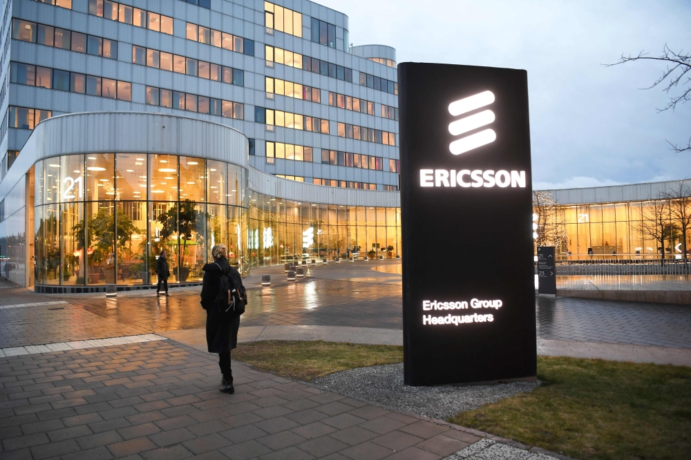 A woman walks past the Ericsson headquarters in Stockholm, Sweden, on January 24, 2020. Photo by Fredrik SANDBERG / TT NEWS AGENCY / AFP