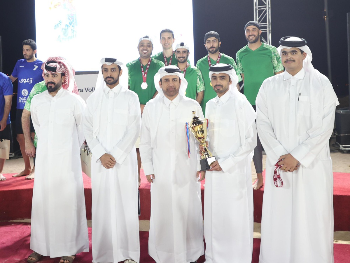 Katara General Manager, Prof. Dr. Khalid bin Ibrahim Al Sulaiti (front row, centre) with other officials and winners during the closing ceremony of the Beach Volleyball Championship.