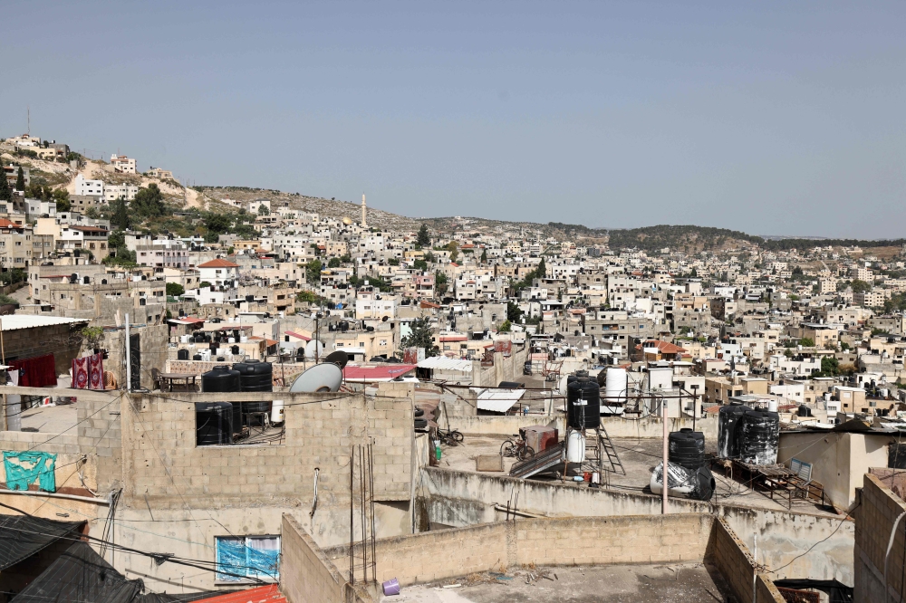 Two Palestinians injured by Israeli occupation forces' bullets in West Bank