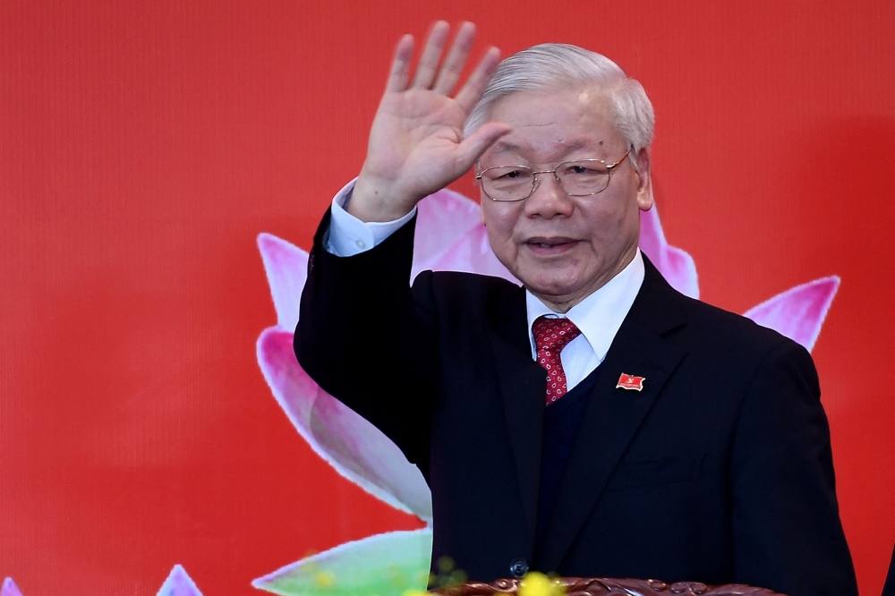Vietnam's newly elected Communist Party general secretary Nguyen Phu Trong waves during a press conference after the closing ceremony of the Communist Party of Vietnam (CPV) 13th National Congress at the National Convention Centre in Hanoi on February 1, 2021. Photo by Nhac NGUYEN / AFP