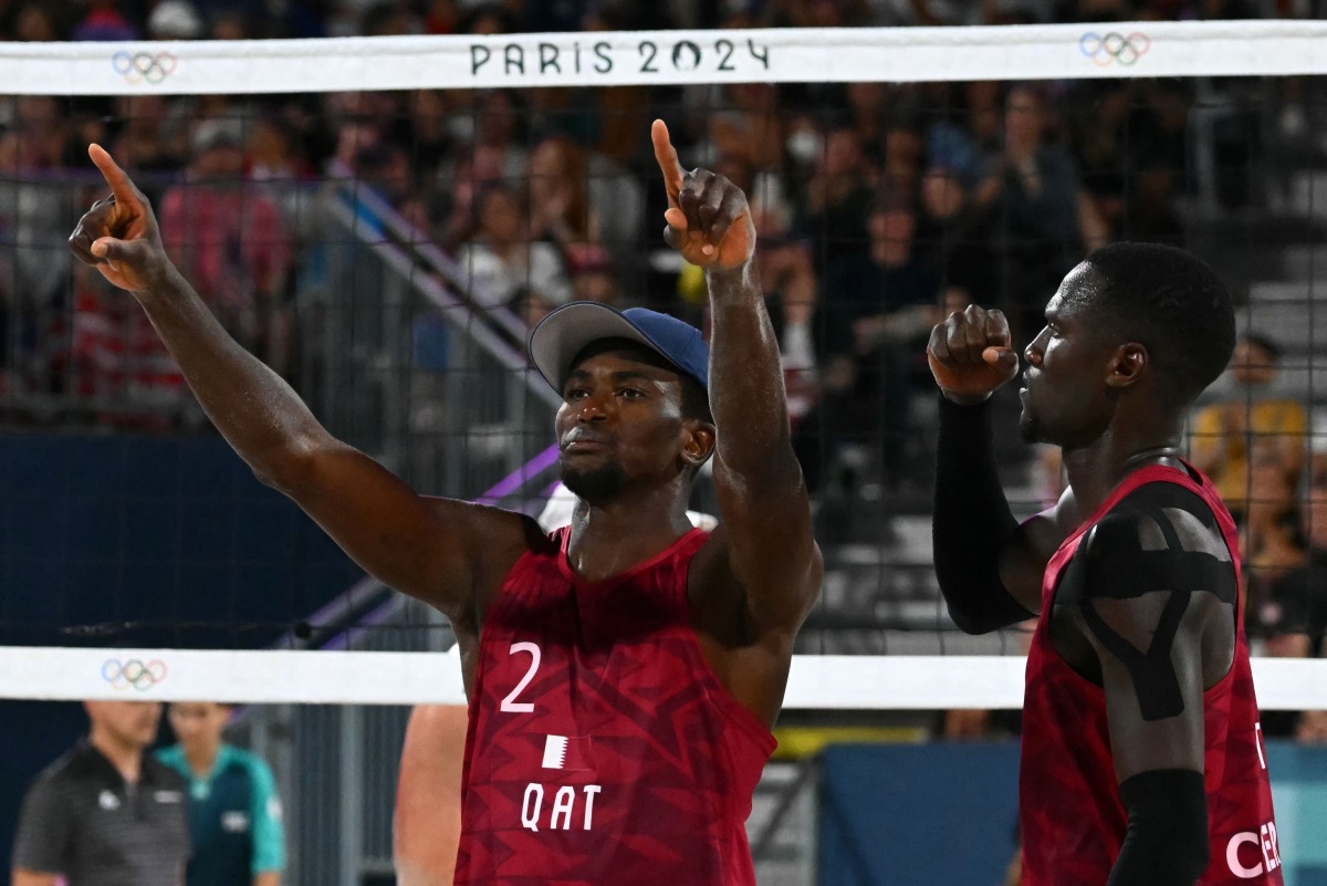 Qatar’s Ahmed Tijan (left) and Cherif Younousse celebrate after scoring a point against USA. AFP