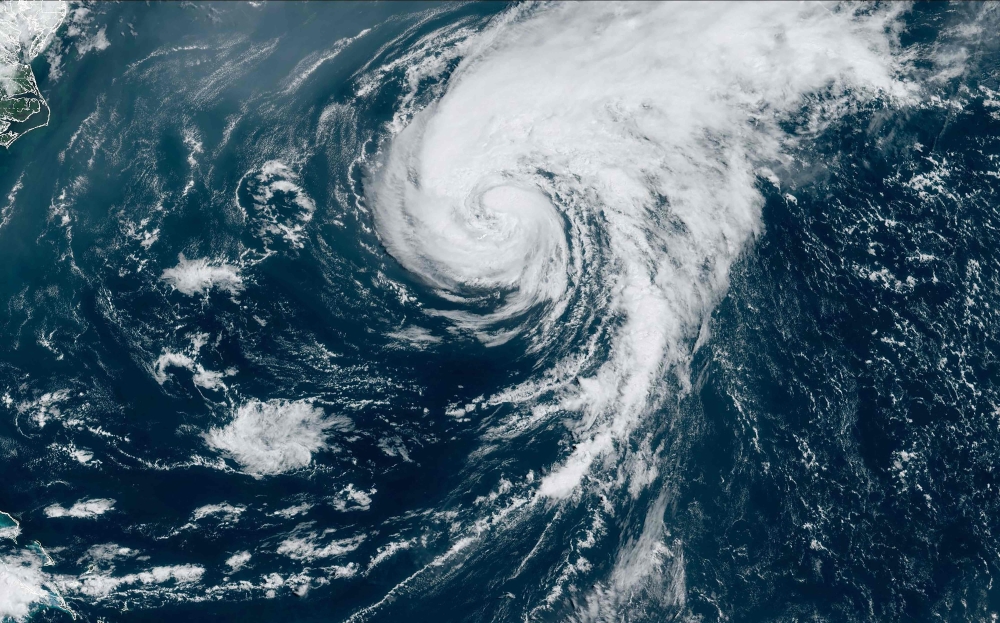 Hurricane Ernesto downgraded to tropical storm as it exits Bermuda