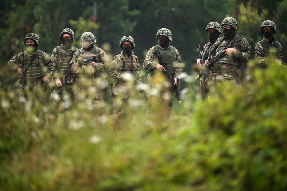 Ukrainian soldiers take part in a casualty simulation training excercise operated by Britain's armed forces, as part of the Interflex programme, in southern England, on August 22, 2024. (Photo by Justin Tallis / AFP)
