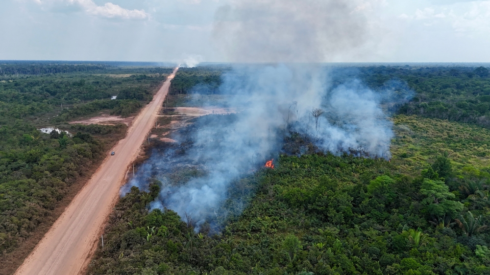 Aerial image of an area of Amazon rainforest affected by illegal fire on the banks of the BR-319 road between Porto Velho, Rondonia State and Manaus, Amazonas State, northern Brazil, on August 22, 2024. (Photo by EVARISTO SA / AFP)
