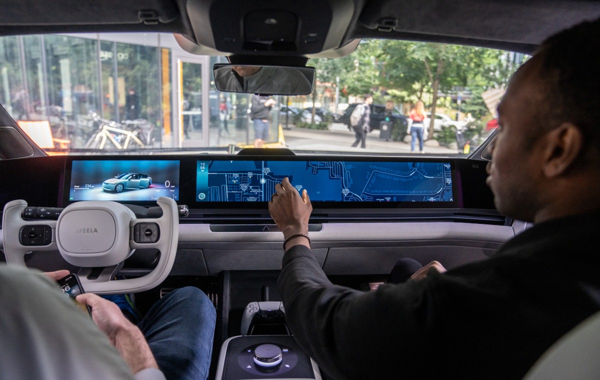 Photo used for demonstration purposes. Tech Specialist Raisu Williams demonstrates the media bar of the Sony Honda Mobility AFEELA prototype electric vehicle powered by Amazon Web Services on September 13, 2024 in Seattle, Washington. Photo by STEPHEN BRASHEAR / GETTY IMAGES NORTH AMERICA / Getty Images via AFP.