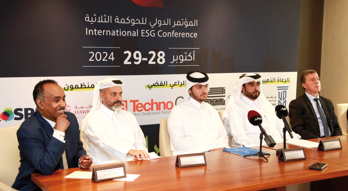 Officials address a press conference to announce details of the conference.