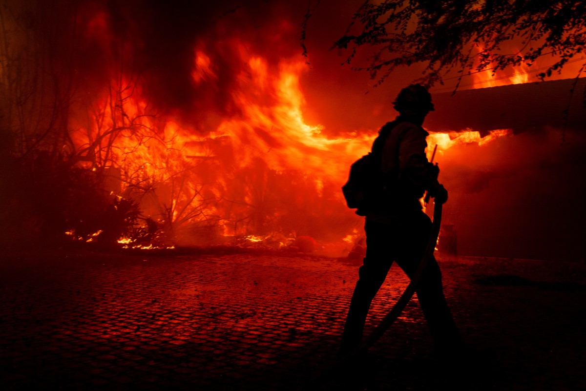 Wildfire tears through Southern California community after burning dozens of homes